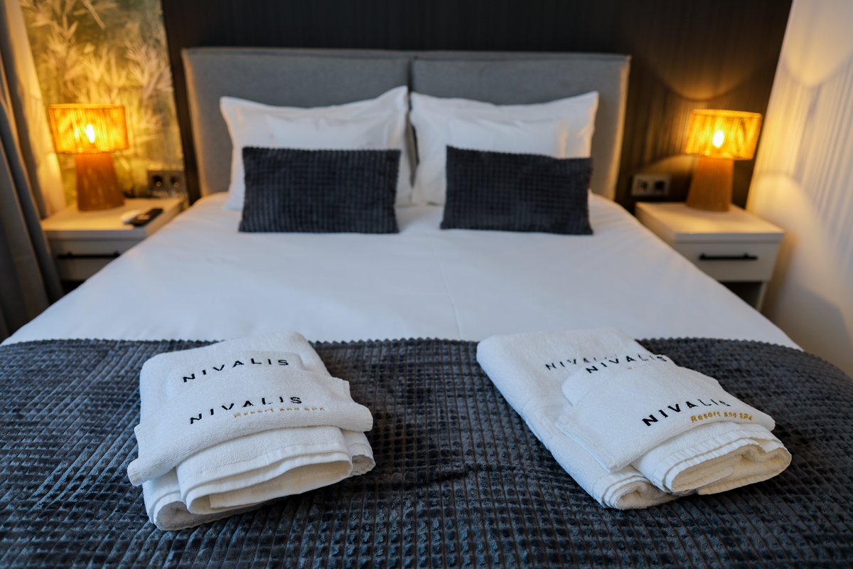 Cozy bed in a Nivalis Resort & SPA chalet