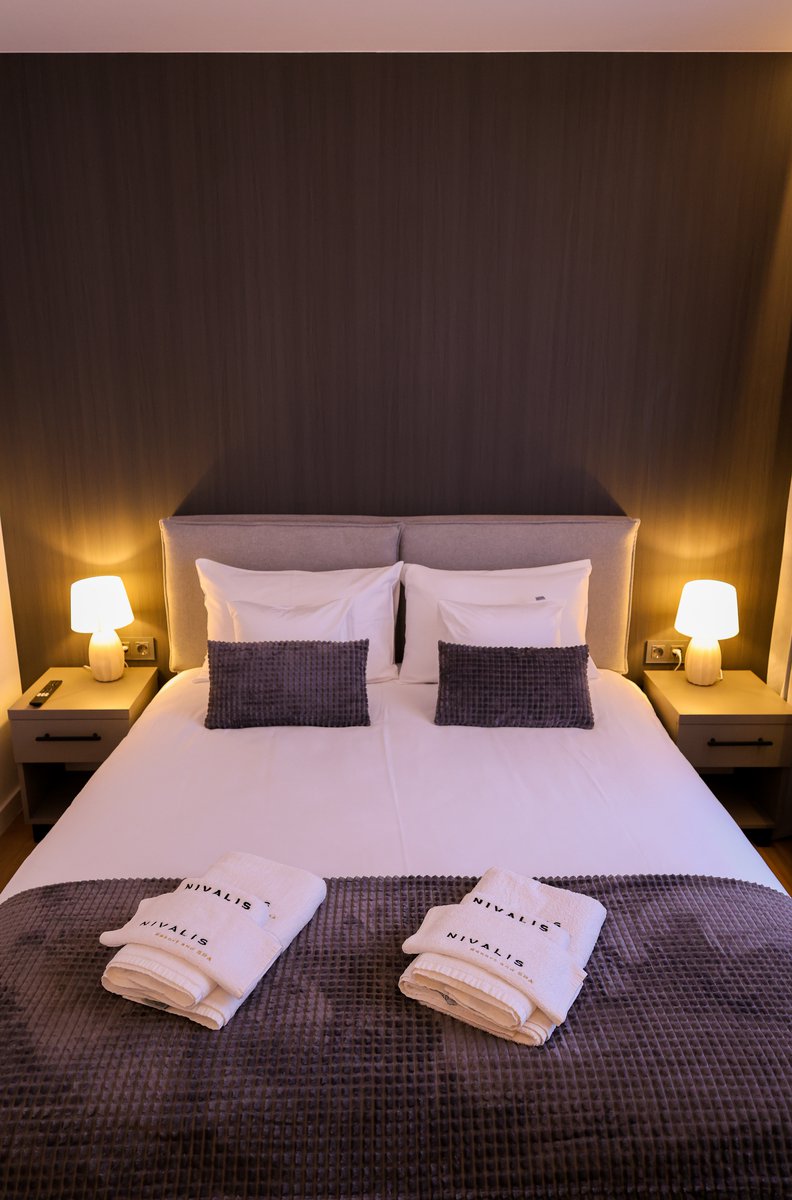 Naturally lit bedroom interior at Nivalis Resort & SPA